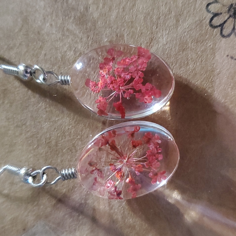 Orange Flowers encapsulated in an acrylic oval
